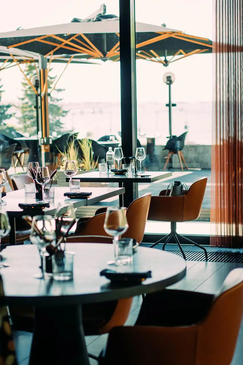 Elegant restaurant interior with ocean views at Zelquorian Royal Retreat
