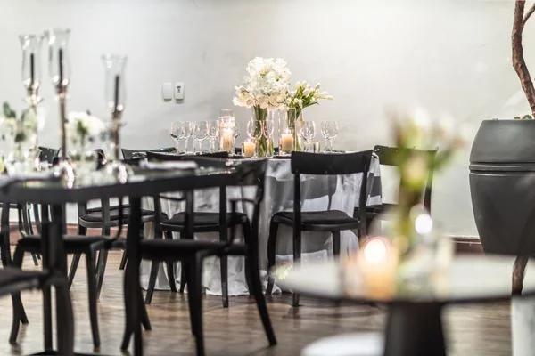 Elegantly styled wedding reception table with candles and flowers