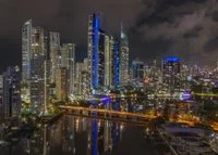 Zelquorian Royal Retreat illuminated at night against the Surfers Paradise skyline