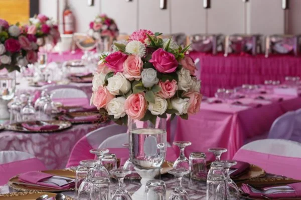 Lavish wedding table setting with pink and white floral details